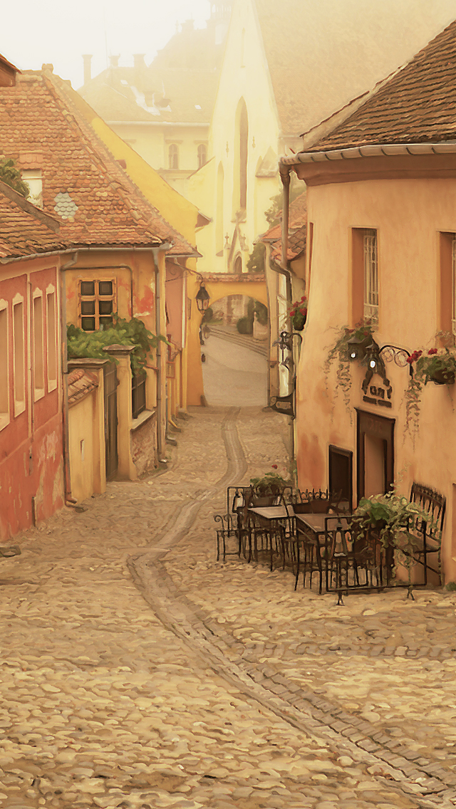 EXT. COBBLED STREET – DAY